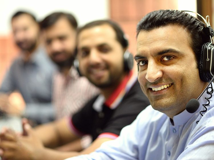 man in white button up shirt smiling
